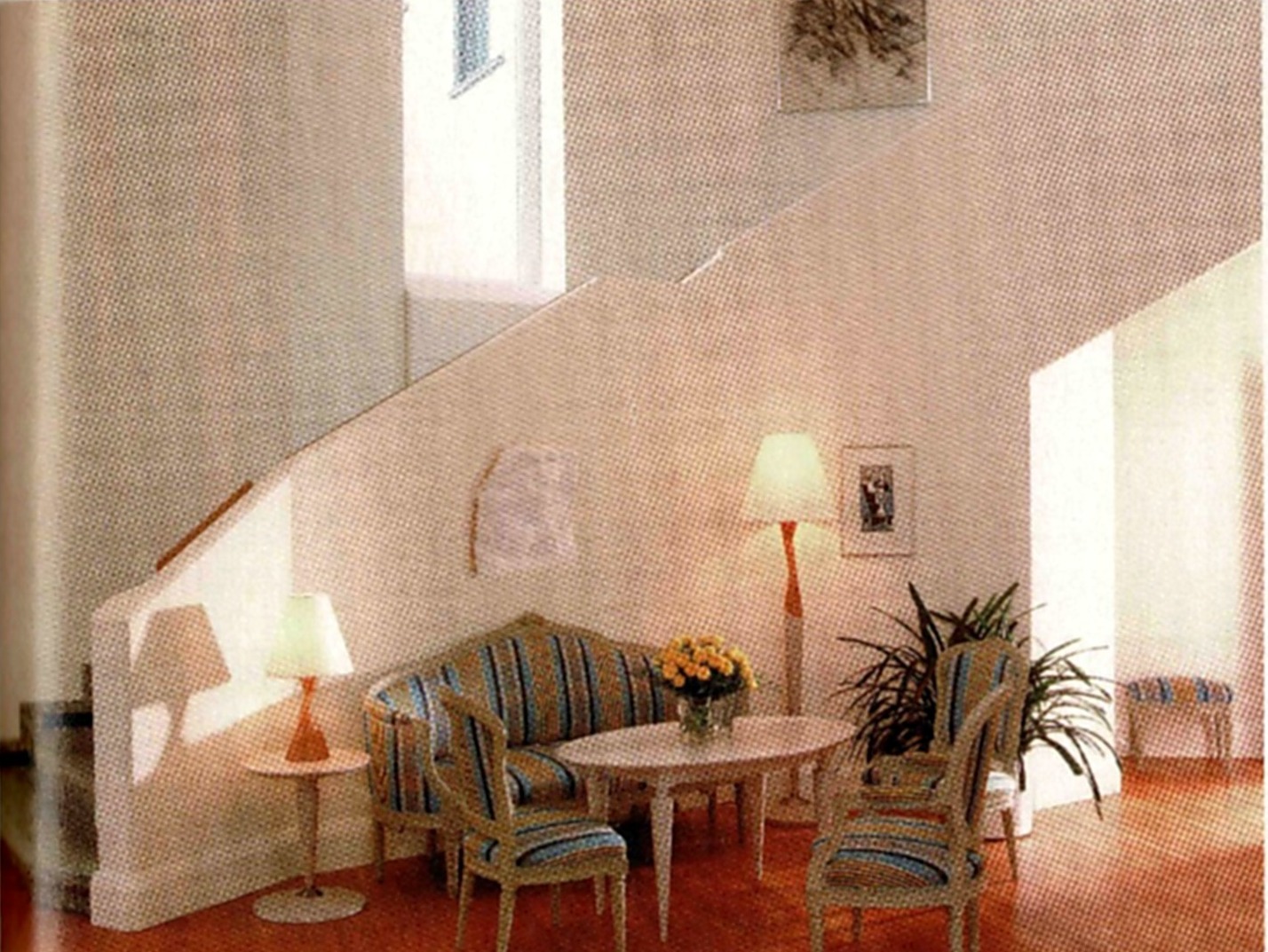 Entrance hall of Mäntyniemi, the Finnish presidential residence, with a Gustavian seating group under the staircase and bespoke tables and lamps